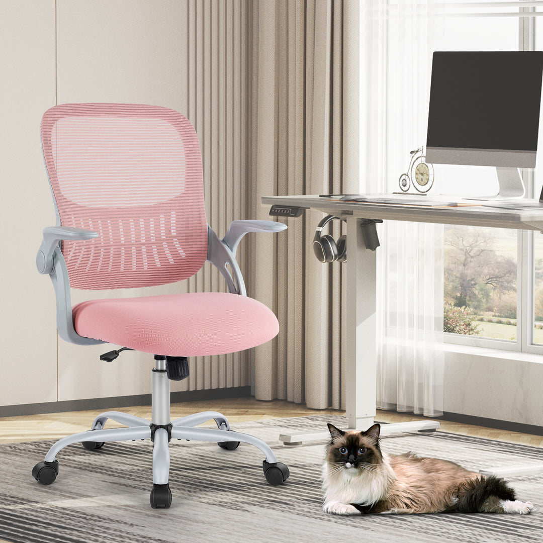 A tall pink office chair with adjustable footring, situated in a room with a white desk and a cat lying on the floor.